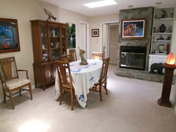 Currently used for dining, the family room has a wood-burning fireplace